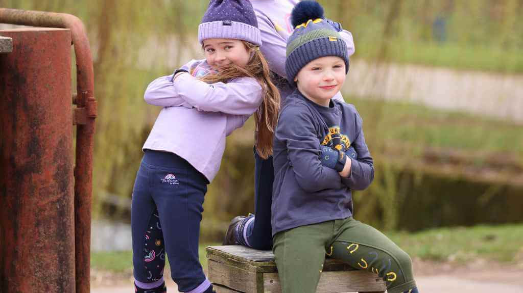 Children's brown leather horse riding boots with buckle closure and ankle strap.