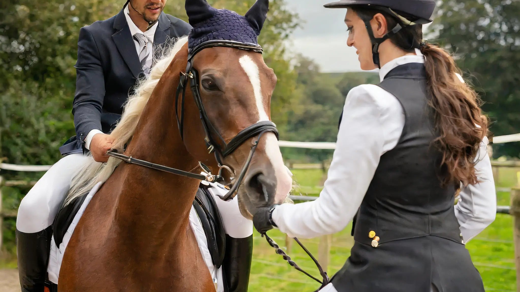 man and a woman on a horse