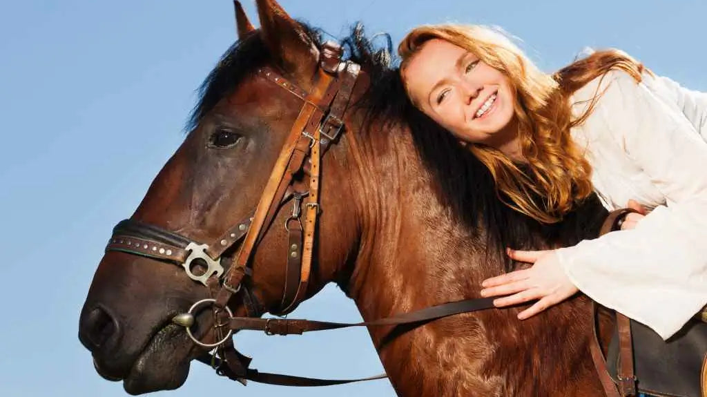 woman hugging a horse - just horse riders
