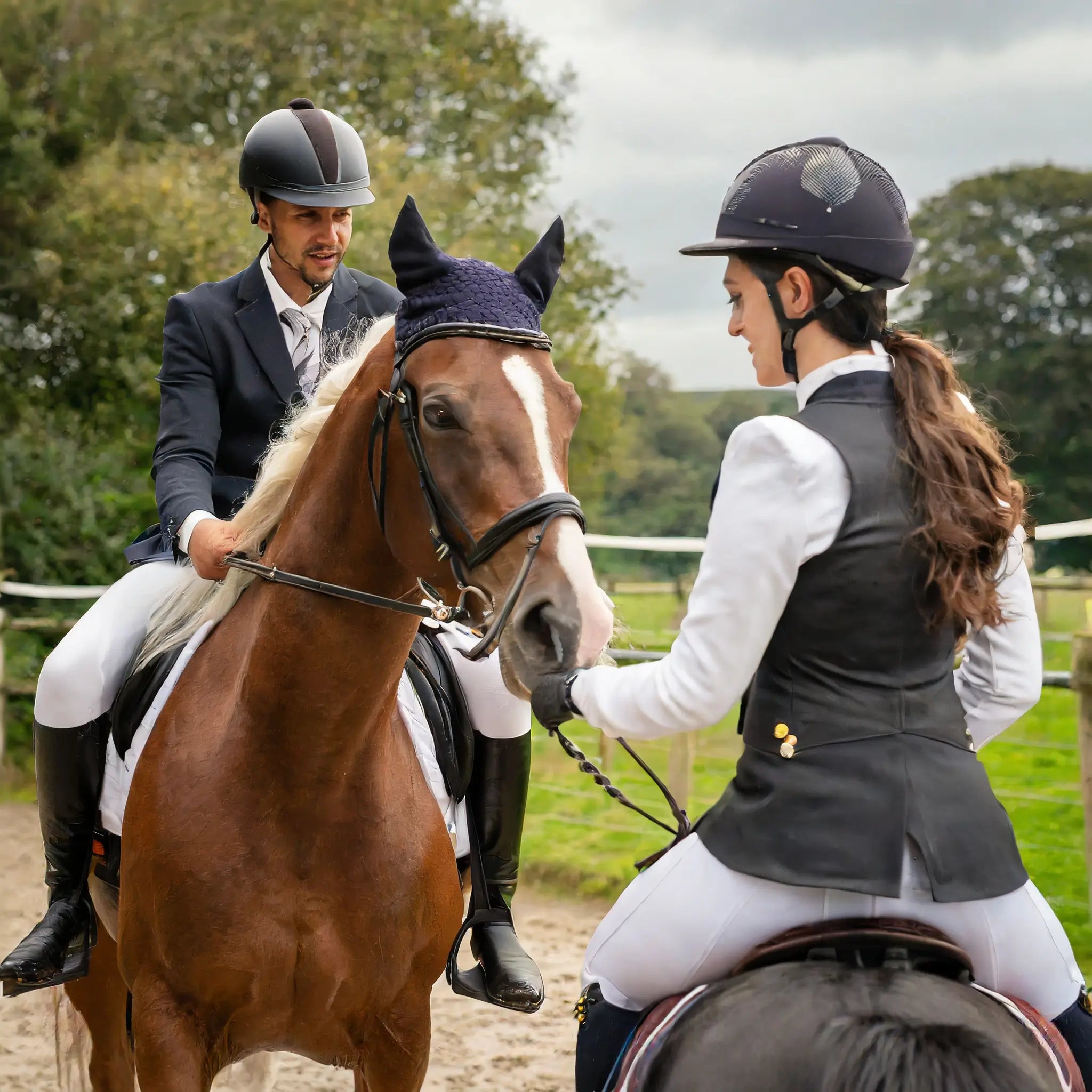 man and a woman on a horse