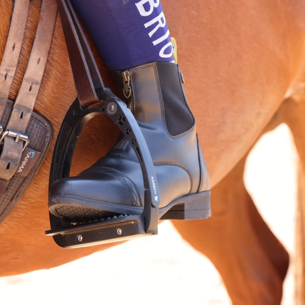 Black jodhpur boot in a stirrup