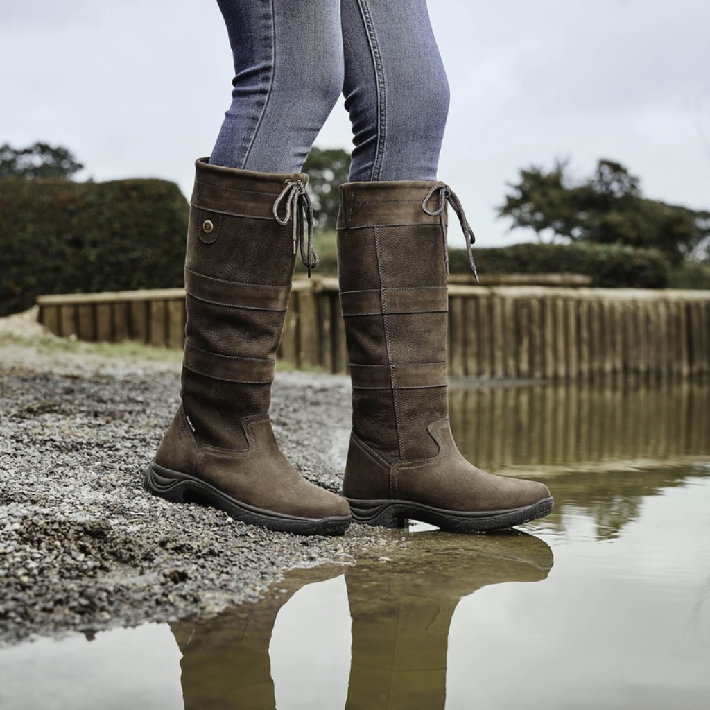 Taupe leather country boots by the water