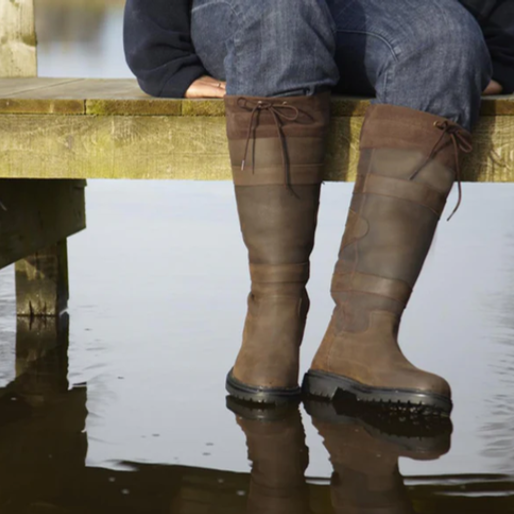 Toggi brown leather country boots on a jetty