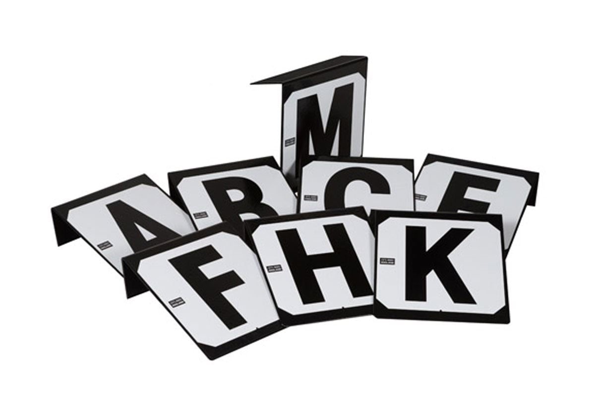 Set of black and white dressage arena marker boards showing the letters A, B, C, E, F, H, K and M