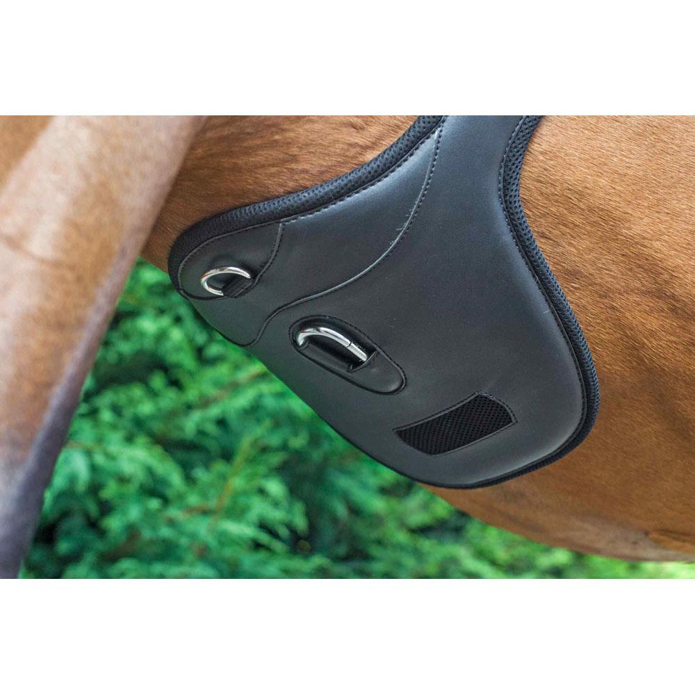 Black anatomic stud girth fitted on a bay horse in a green paddock