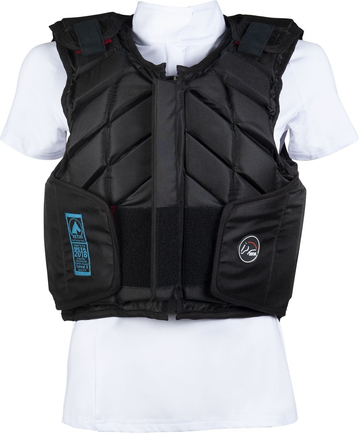 Rider wearing a black padded equestrian body protector vest over a white shirt